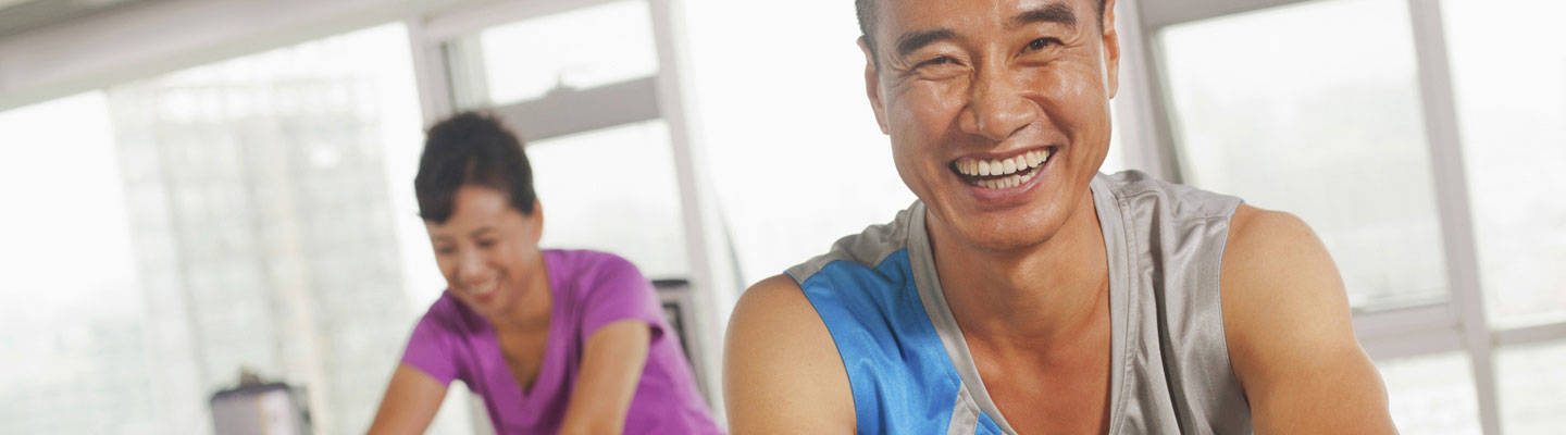 Rehabilitation patients exercising on indoor bicycles.